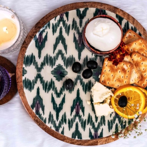 PURE-MANGO-WOOD-ROUND-PLATTER-WITH-ALL-OVER-IKKAT-ENAMELING-IN-JEWEL-TONES-